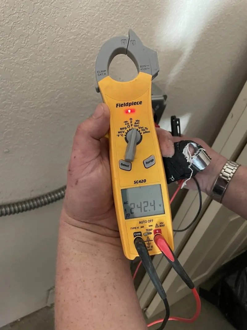 Voltage testing with clamp meter during Electrical Installation Services in Merrimac